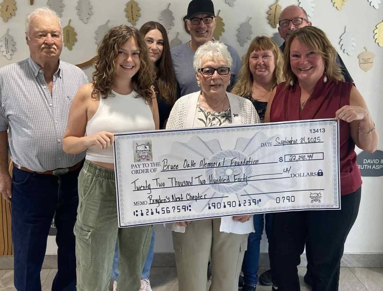 Brayden's Next Chapter family presenting the donation cheque to the Bruce Oake Memorial Foundation