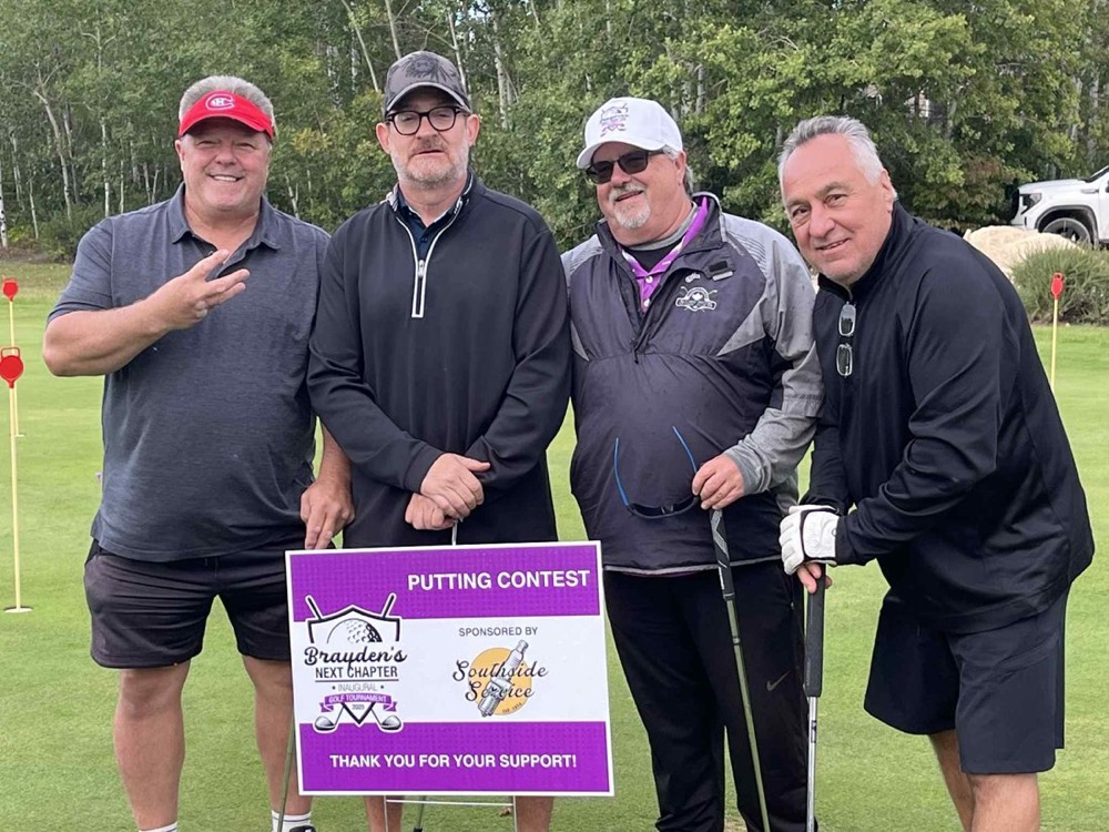 A team at the putting contest, Brayden's Next Chapter tournament